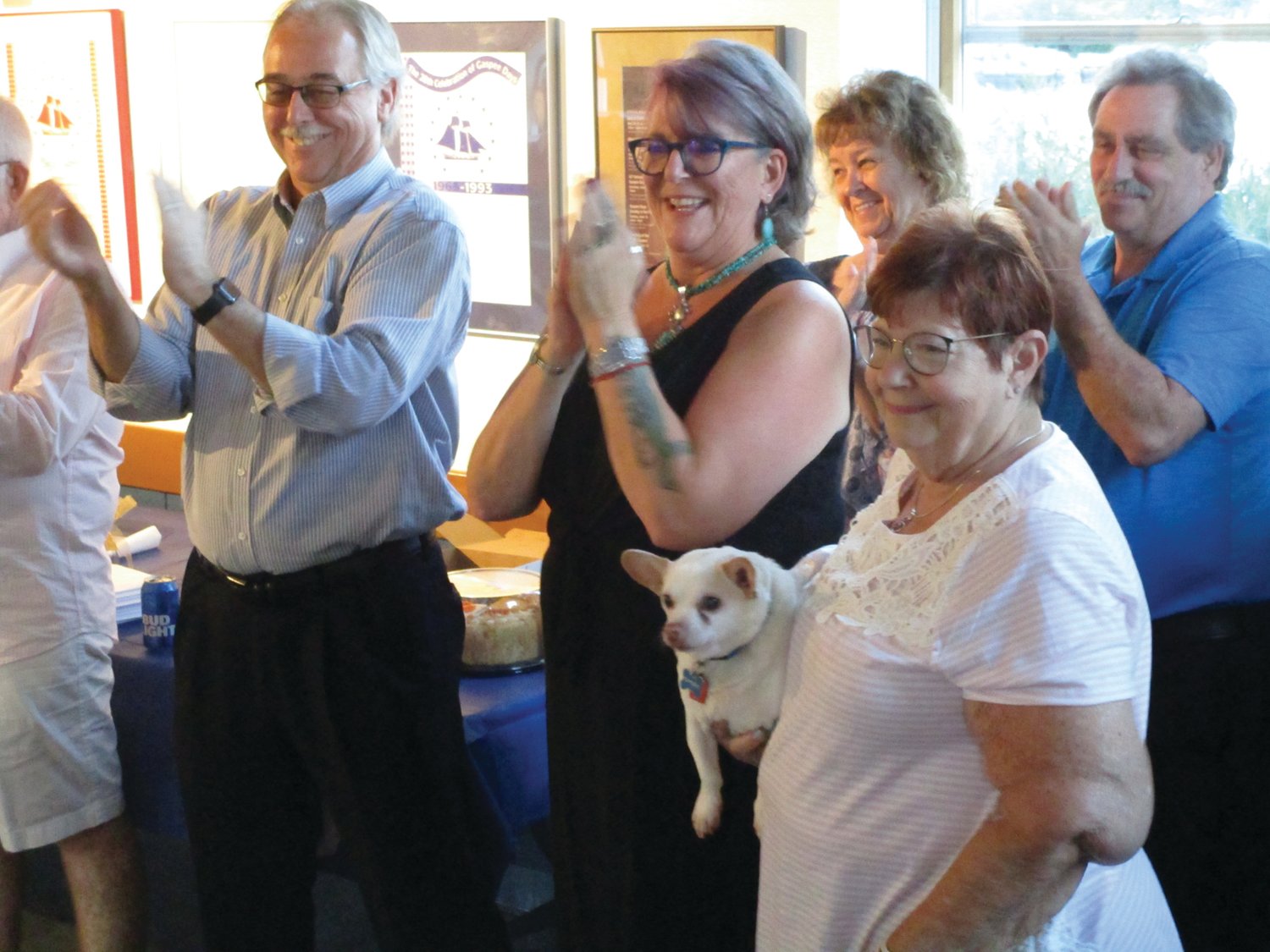 HONORARY OFFICER: Gaspee Days Committee corresponding secretary Jan Rooney, seen holding her dog, joins the new officers during last week’s ceremony.